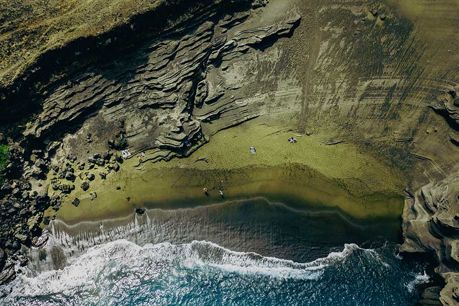 
A top-down drone view of PapaKōlea Green Sand Beach, Big Island, Hawai'i